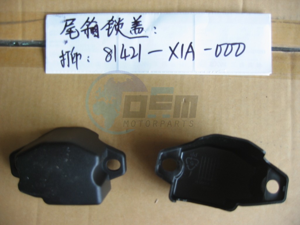 Product image: Sym - 81421-X1A-000 - TRUNK BOX  LOCK COVER  0