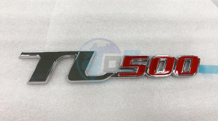 Product image: Sym - 87127-TL1-100 - L. BODY COVER EMBLEM (TL500)  0