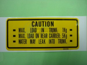 Product image: Sym - 81218-E32-000 - TRUNK CAUTION LABEL 