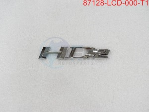 Product image: Sym - 87128-LCD-000-T1 - L. BODY COVER EMBLEM TYPE1 