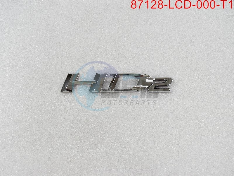 Product image: Sym - 87128-LCD-000-T1 - L. BODY COVER EMBLEM TYPE1  0