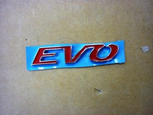 Product image: Sym - 87129-LVA-000 - BODY COVER EMBLEM A 